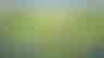 An AI-generated image of a train rolling through a peaceful rolling meadow, towing lots of train cars that read words like “build”, “test”, and “deploy” on the sides