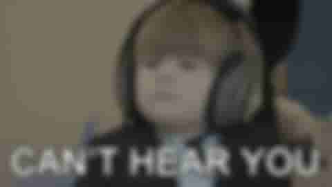 A gif of a child with headphones on, unable to hear anything around him; another representation of ignoring things